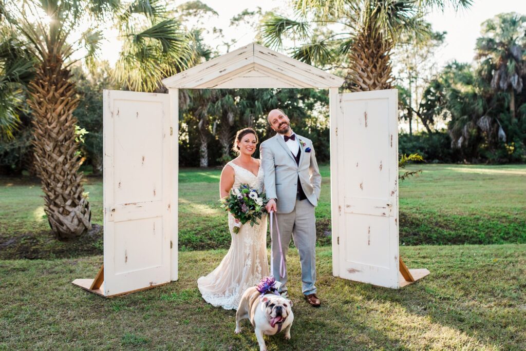 bride and groom with their bulldog