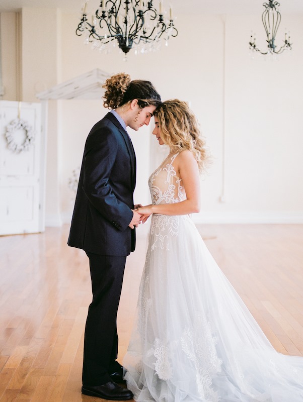 bride and groom holding hands