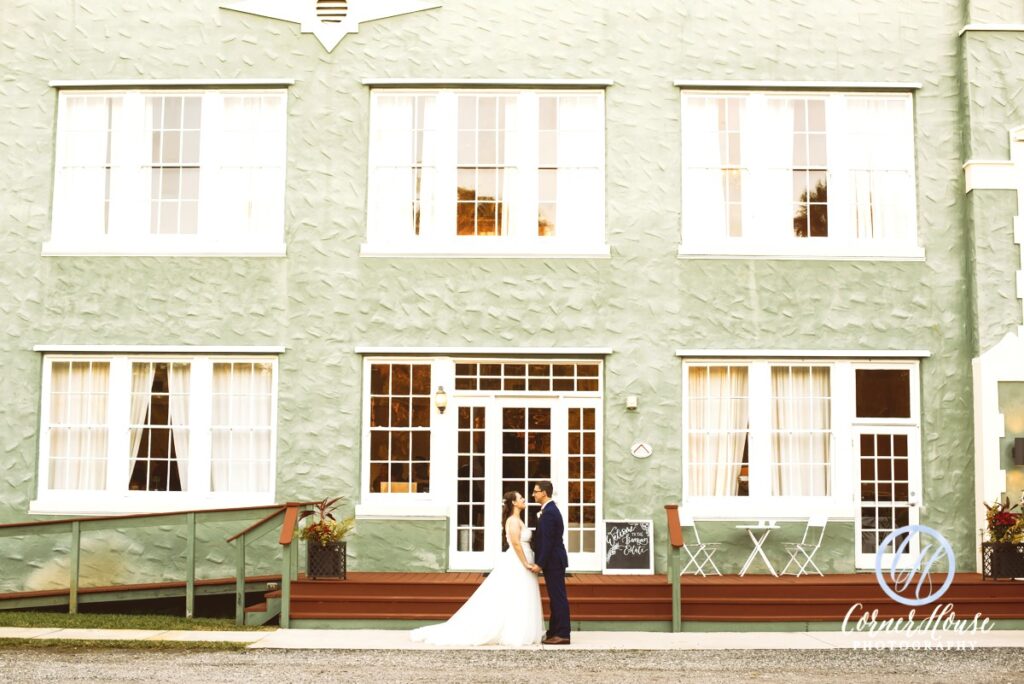 bride and groom outside the banyan estate