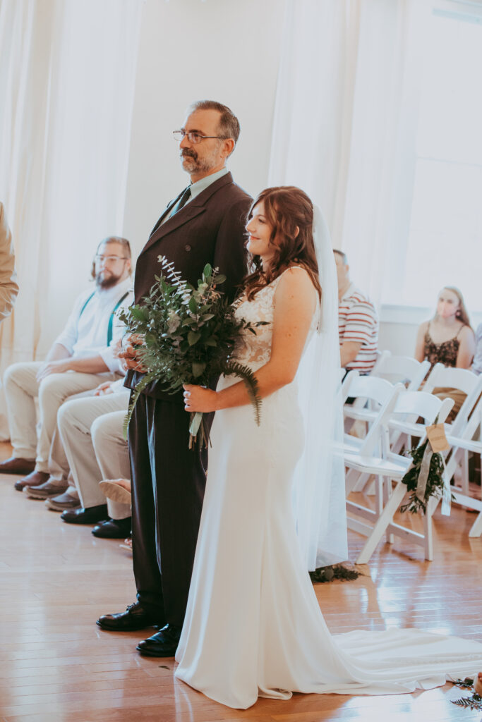 father walking bride down aisle