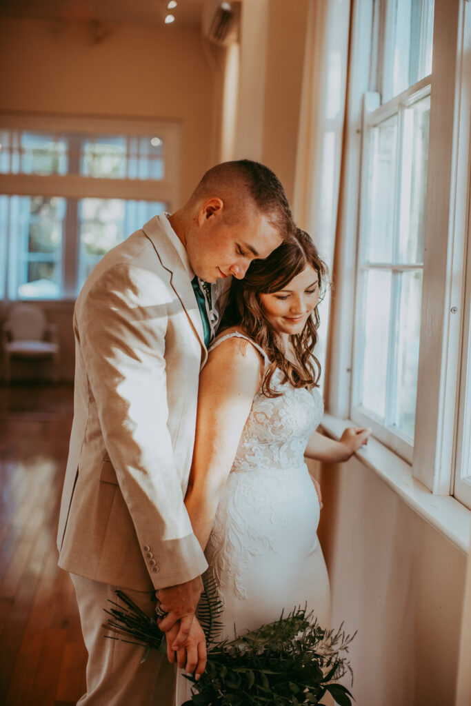 bride and groom embracing