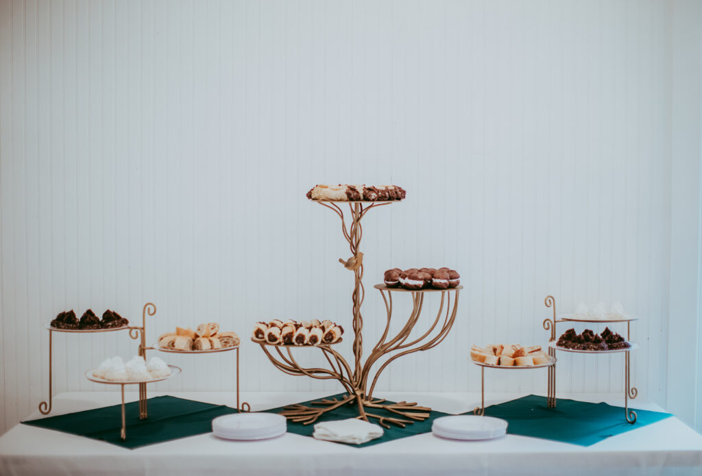desserts and appetizers on gold serving stands