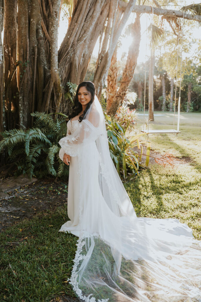 bride under tropical trees