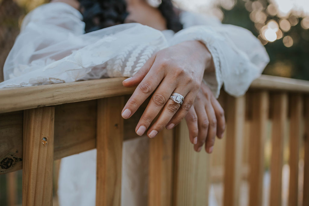 bride's wedding ring and engagement ring