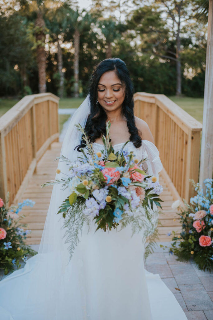 bride looking at bridal bouquet