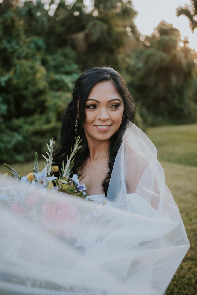 bride surrounded by flowing veil