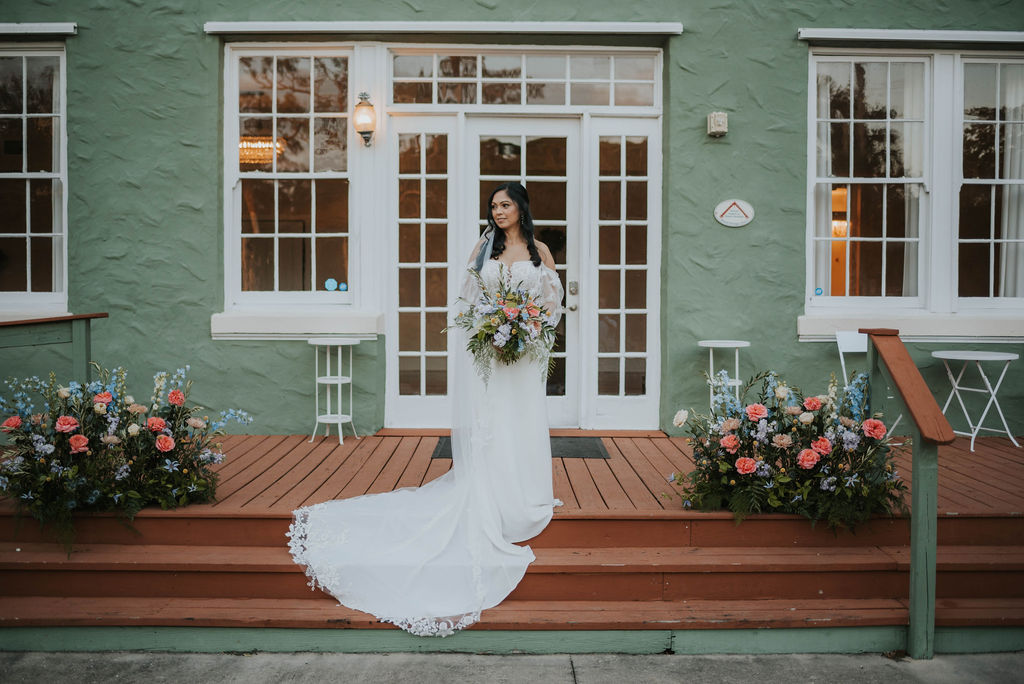 bride on the banyan estate porch steps
