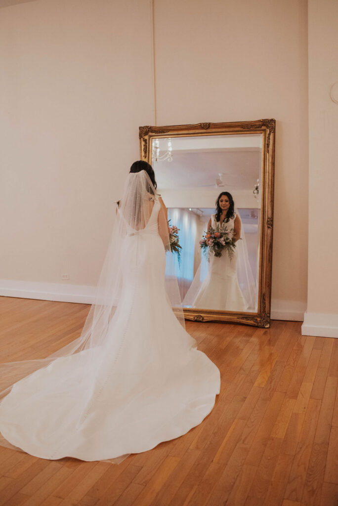 bride looking in mirror