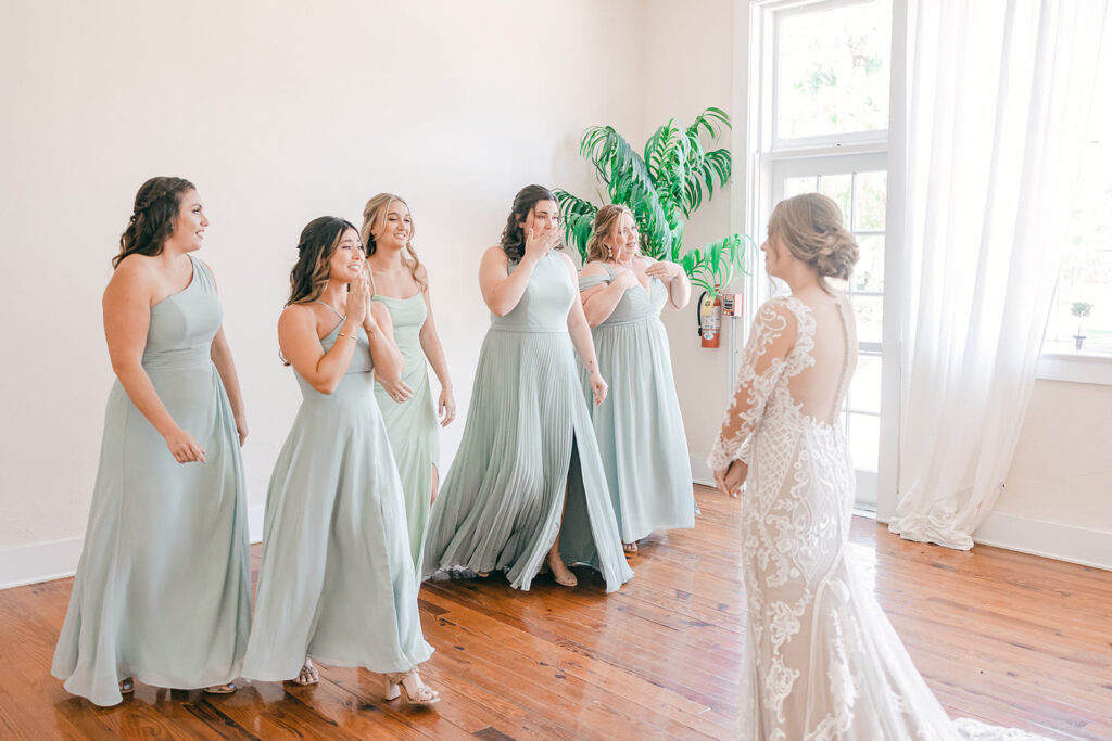 first look of bride with bridesmaids 